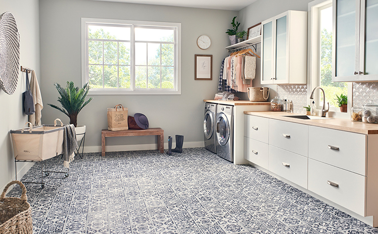 Light colored tile floor in laundry room